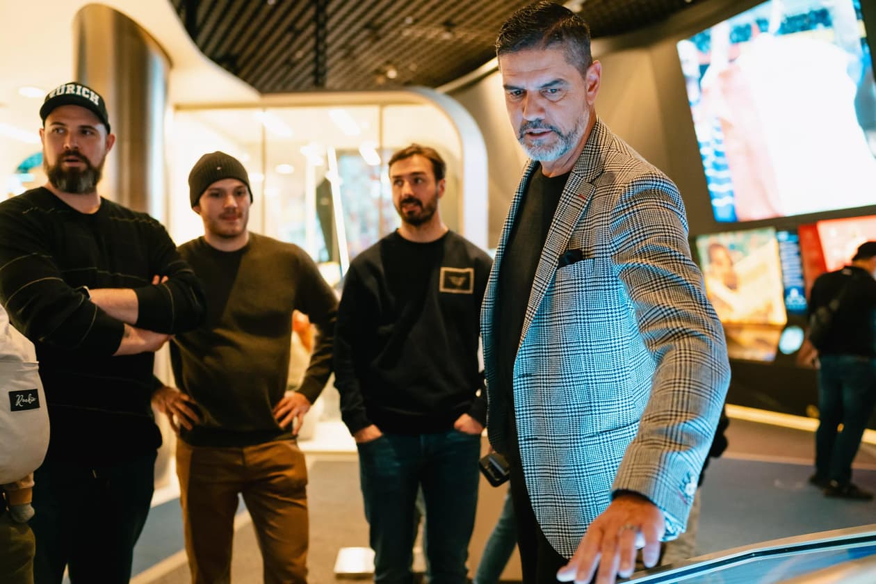 A delegation from the Zürcher Schlittschuh Club Lions (ZSC Lions, Zurich ice-hockey team) is seen visiting the FIFA Museum, in Zurich. Here, toured by Pascal Zuberbühler (former Switzerland international goalkeeper and Museum's ambassador).